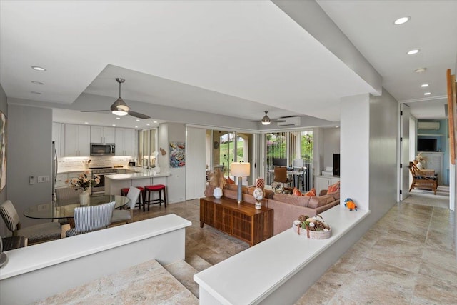 3150 Wailea Alanui Dr Unit 3007, Kihei, HI 96753 - living room with a ceiling fan, recessed lighting, and an AC wall unit