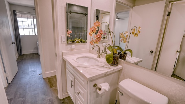 140 Uwapo Rd Unit 2-202, Kihei, HI 96753 - bathroom featuring wood finished floors, vanity, and ceiling fan