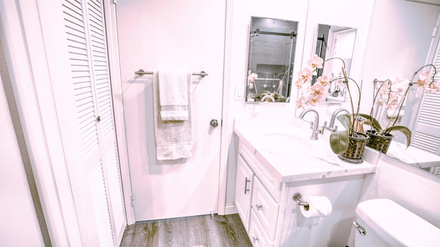 140 Uwapo Rd Unit 2-202, Kihei, HI 96753 - bathroom featuring a closet, wood finished floors, and vanity