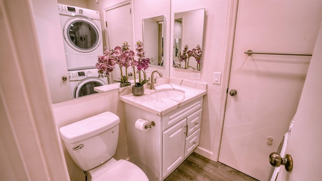 140 Uwapo Rd Unit 2-202, Kihei, HI 96753 - half bath with stacked washer and clothes dryer, vanity, and wood finished floors