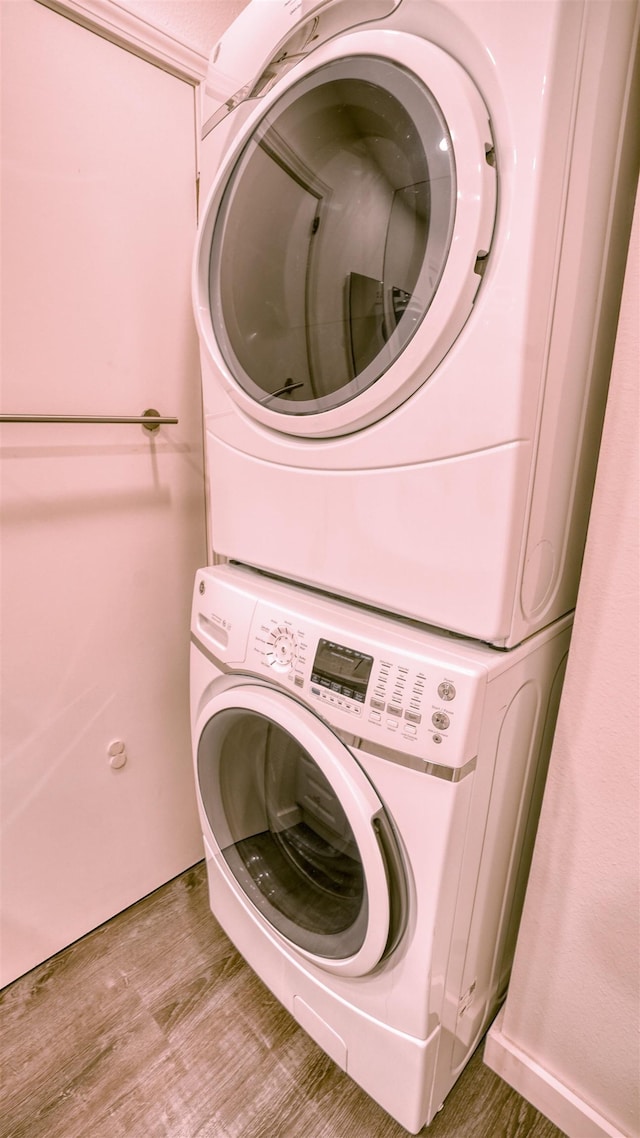 140 Uwapo Rd Unit 2-202, Kihei, HI 96753 - laundry area with stacked washer / drying machine and light wood-style flooring