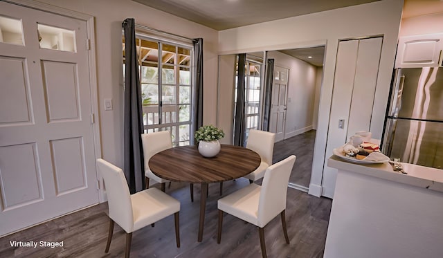 140 Uwapo Rd Unit 2-202, Kihei, HI 96753 - dining room with dark wood-style flooring and baseboards