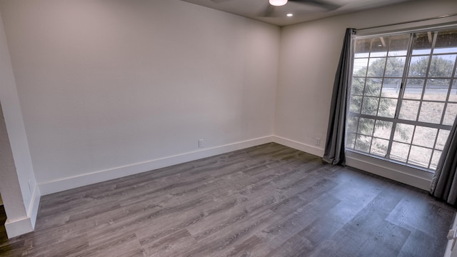 140 Uwapo Rd Unit 2-202, Kihei, HI 96753 - spare room with a ceiling fan, dark wood-style floors, and recessed lighting