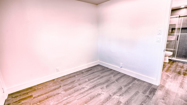140 Uwapo Rd Unit 2-202, Kihei, HI 96753 - spare room featuring wood finished floors and baseboards
