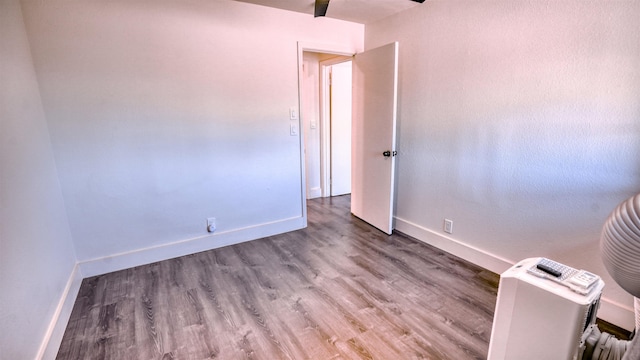 140 Uwapo Rd Unit 2-202, Kihei, HI 96753 - spare room featuring baseboards and wood finished floors