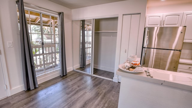 140 Uwapo Rd Unit 2-202, Kihei, HI 96753 - dining area featuring dark wood-style flooring and baseboards