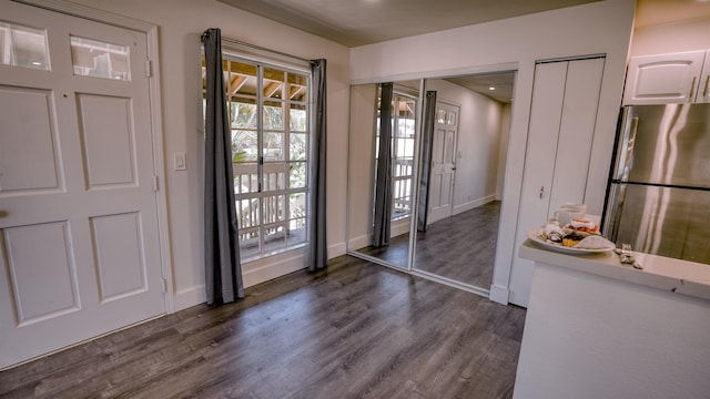 140 Uwapo Rd Unit 2-202, Kihei, HI 96753 - foyer entrance with dark wood-style floors and healthy amount of natural light