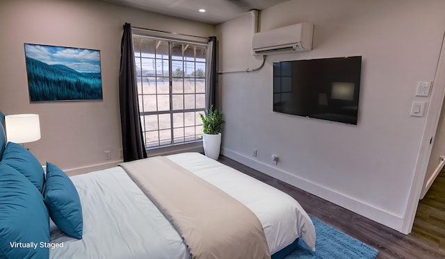 140 Uwapo Rd Unit 2-202, Kihei, HI 96753 - bedroom featuring an AC wall unit, wood finished floors, and recessed lighting