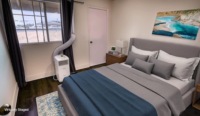 140 Uwapo Rd Unit 2-202, Kihei, HI 96753 - bedroom featuring wood finished floors and baseboards