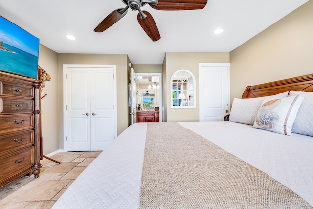 bedroom with ceiling fan and light tile floors