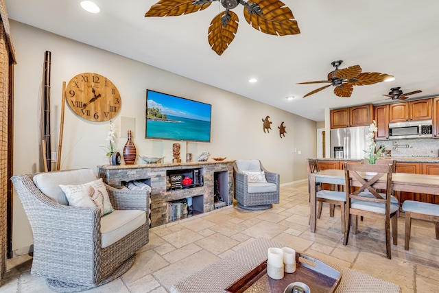 living room featuring ceiling fan and light tile flooring