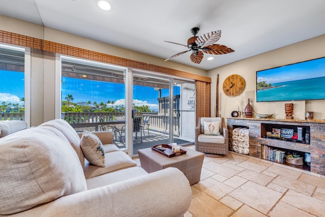 tiled living room featuring ceiling fan