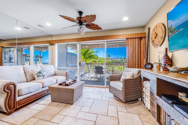 tiled living room with ceiling fan