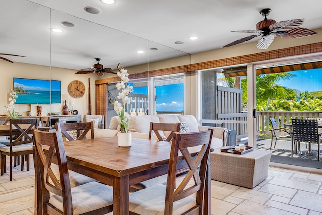 tiled dining area with ceiling fan