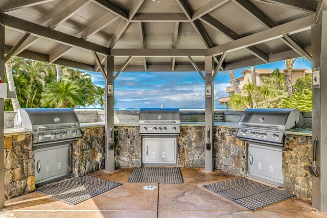 view of patio with area for grilling and an outdoor kitchen