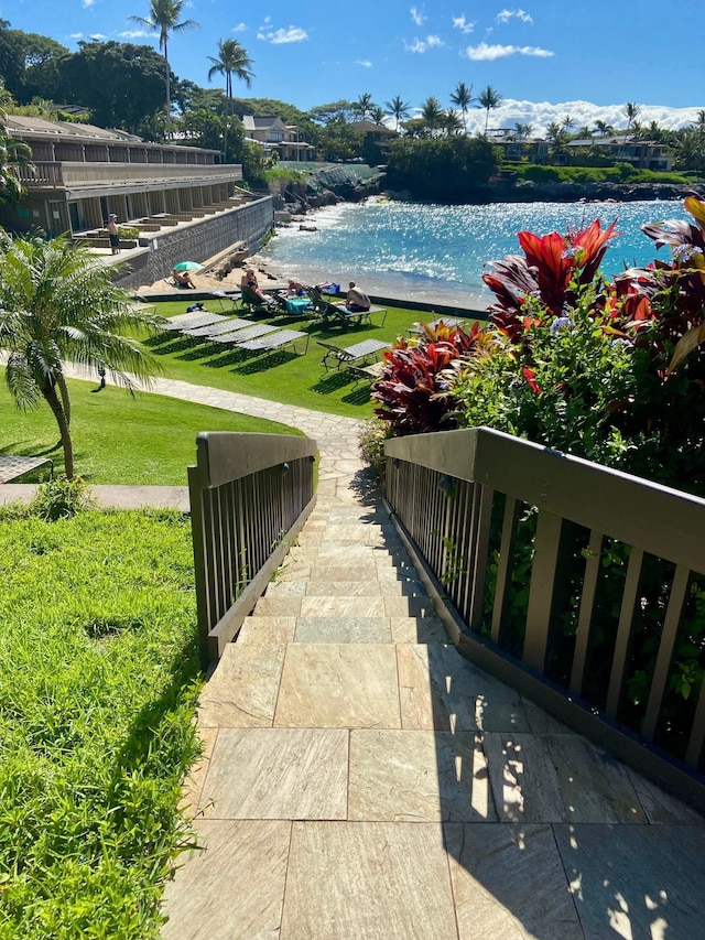 view of nearby features featuring a yard and a water view