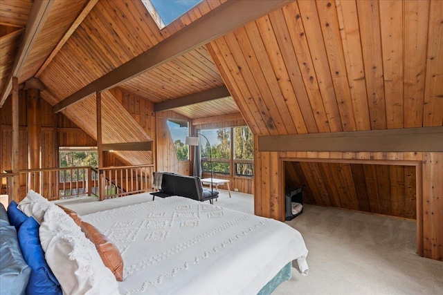 carpeted bedroom featuring wood ceiling, vaulted ceiling with skylight, and wood walls