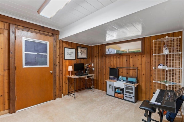 carpeted home office featuring beamed ceiling and wood walls