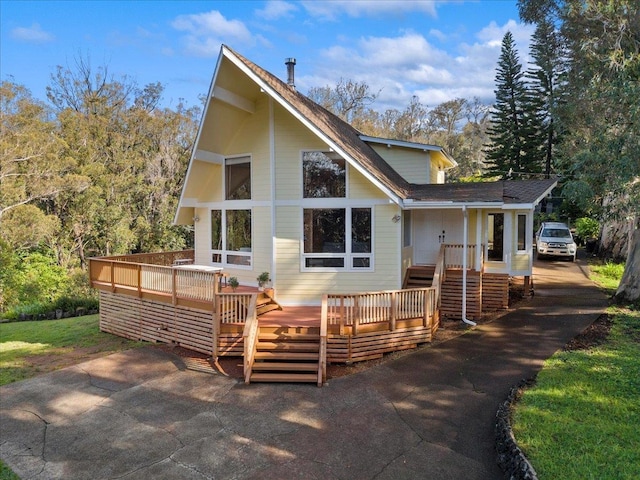 exterior space featuring a wooden deck