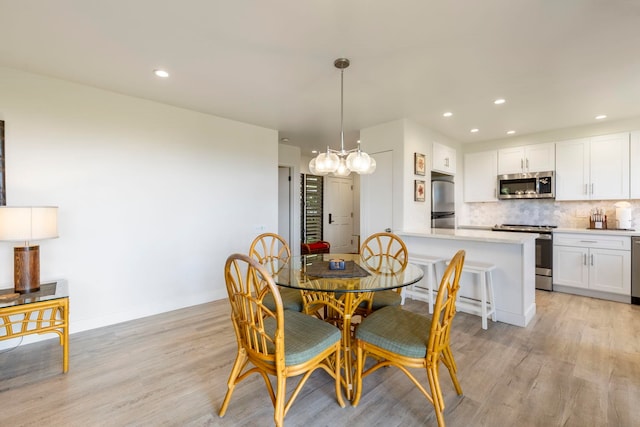 dining room featuring light wood-type flooring