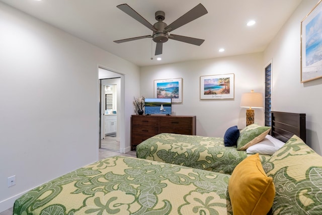 bedroom featuring connected bathroom and ceiling fan