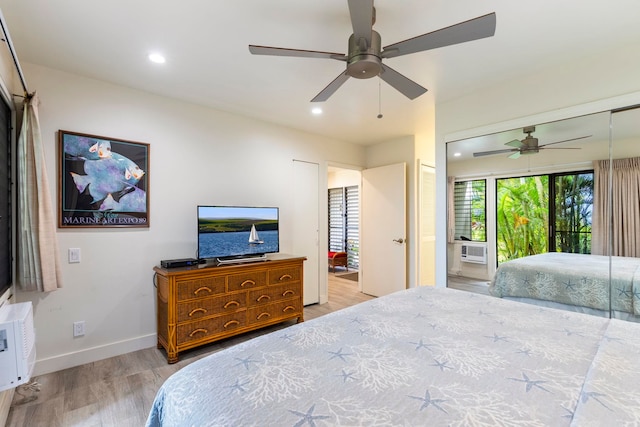 bedroom with ceiling fan and light hardwood / wood-style flooring