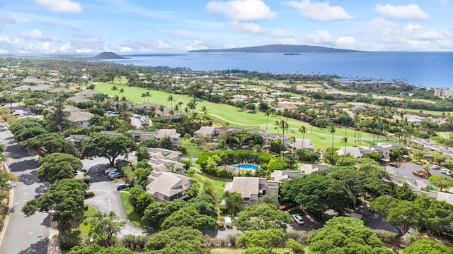 drone / aerial view with a water and mountain view