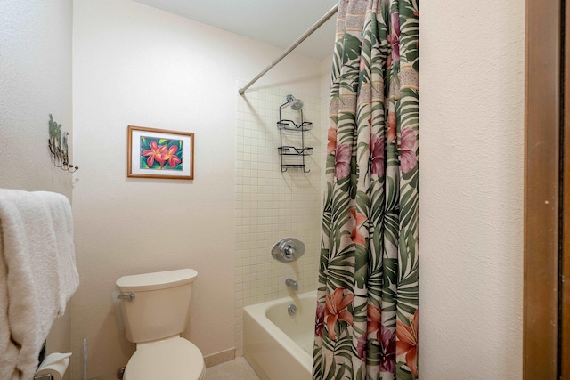 bathroom with toilet and shower / tub combo