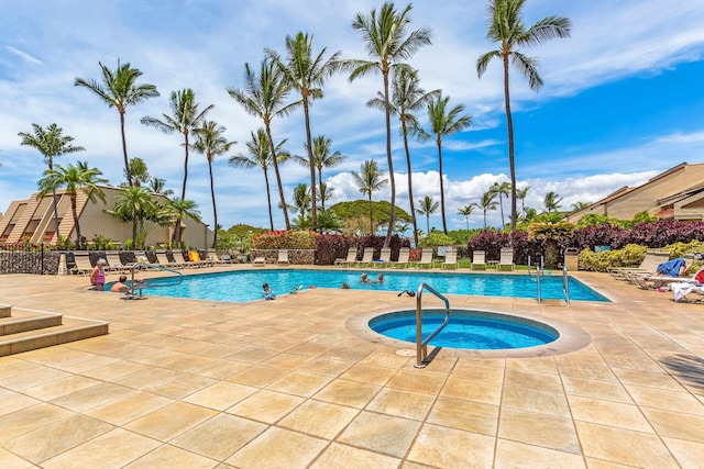 view of swimming pool with a community hot tub and a patio