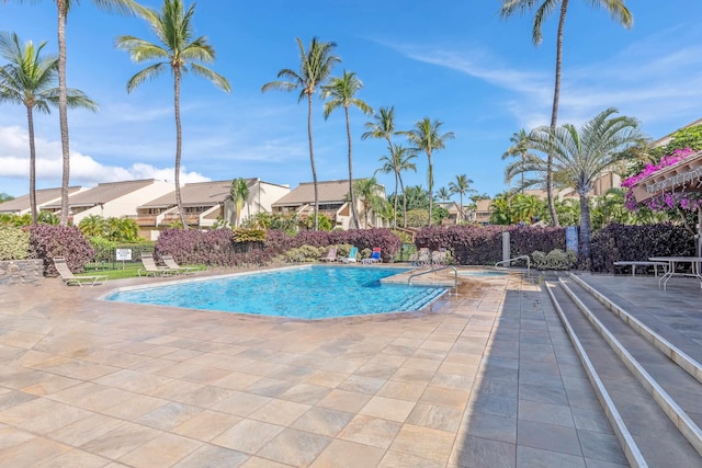 view of swimming pool featuring a patio area