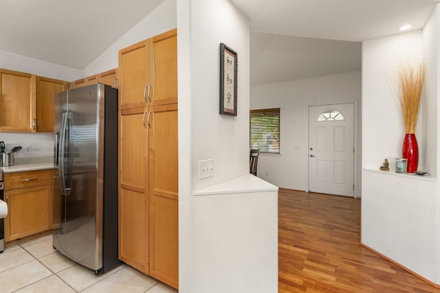 35 Emoloa Pl, Wailuku, HI 96793 - kitchen with freestanding refrigerator, light countertops, light wood-style floors, vaulted ceiling, and recessed lighting