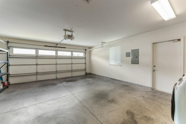 35 Emoloa Pl, Wailuku, HI 96793 - garage featuring electric panel, a garage door opener, and washer / dryer