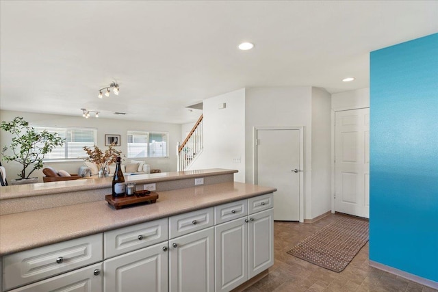 kitchen featuring white cabinets