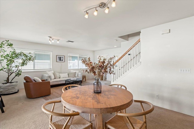 dining area featuring carpet flooring