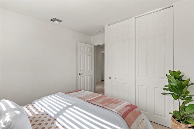 bedroom with a closet and carpet floors