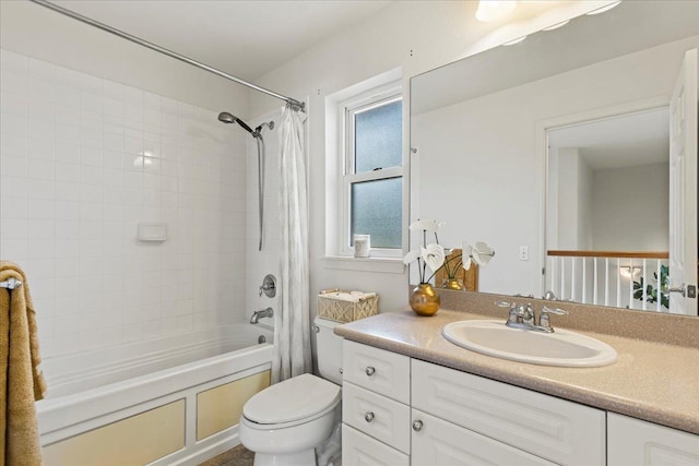 full bathroom with shower / bathtub combination with curtain, vanity, and toilet