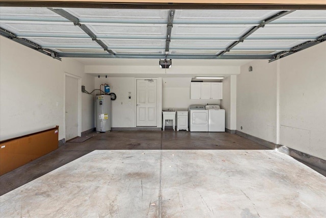 garage featuring sink, water heater, washing machine and clothes dryer, and a garage door opener