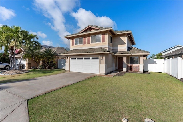 view of front of home with a front lawn and a garage