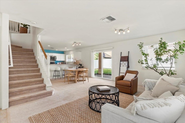 living room featuring light colored carpet