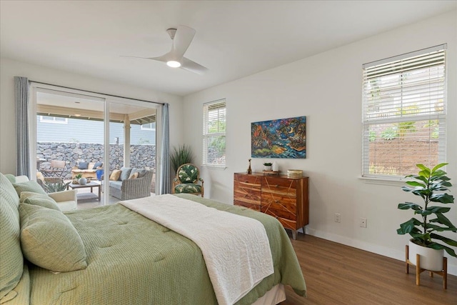 bedroom with hardwood / wood-style floors, ceiling fan, and access to exterior