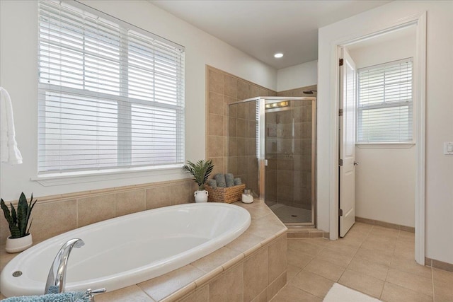 bathroom featuring tile patterned flooring and plus walk in shower