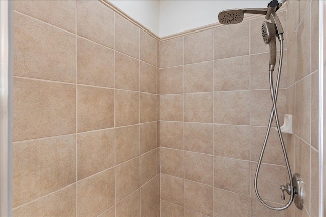 interior space featuring tiled shower