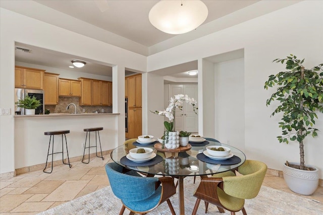 dining area featuring sink