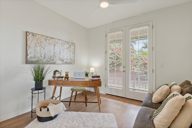 home office with french doors, a healthy amount of sunlight, and light wood-type flooring