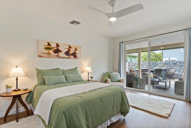 bedroom with ceiling fan, access to exterior, and wood-type flooring