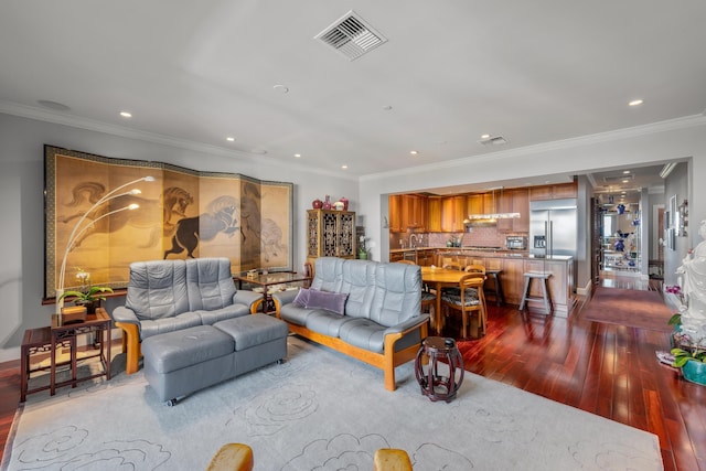 living room with ornamental molding and hardwood / wood-style flooring