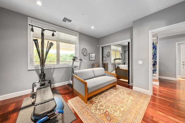 living area with hardwood / wood-style floors