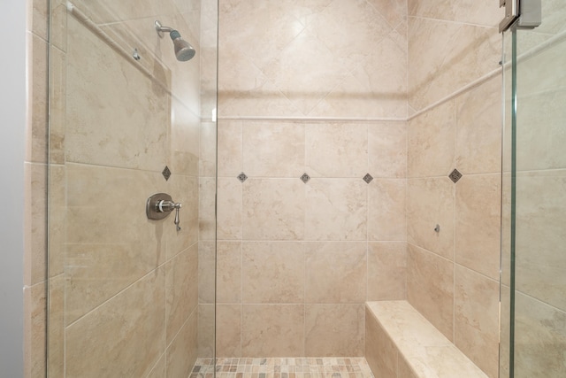 bathroom with tiled shower