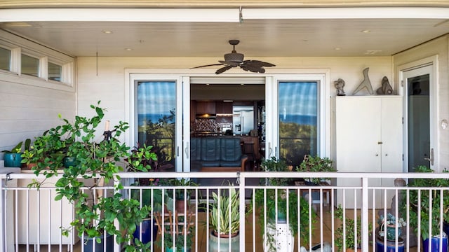 entrance to property with ceiling fan