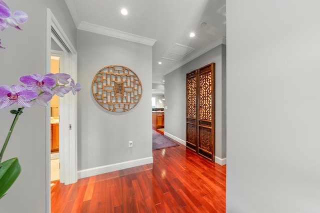 hallway featuring crown molding and hardwood / wood-style floors